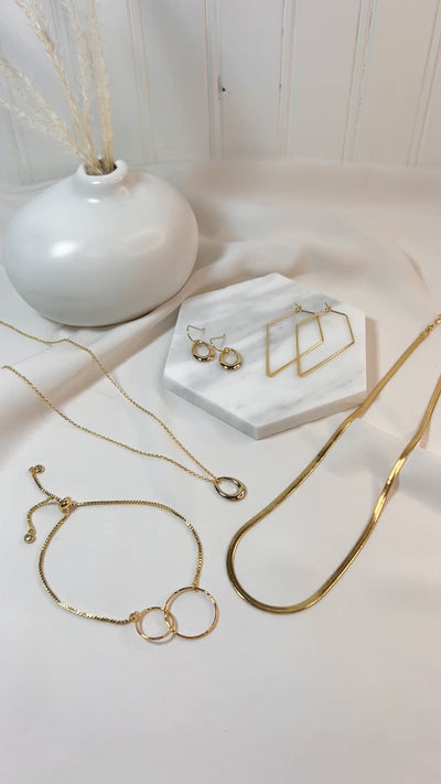 Video of Mega Jewelry Bundle set featuring 18k gold plated brass adjustable bracelet, two unique necklaces and two pairs of matching earrings