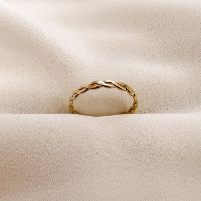 Highly polished 14K gold filled double braided women's stacking ring on  cream coloured background